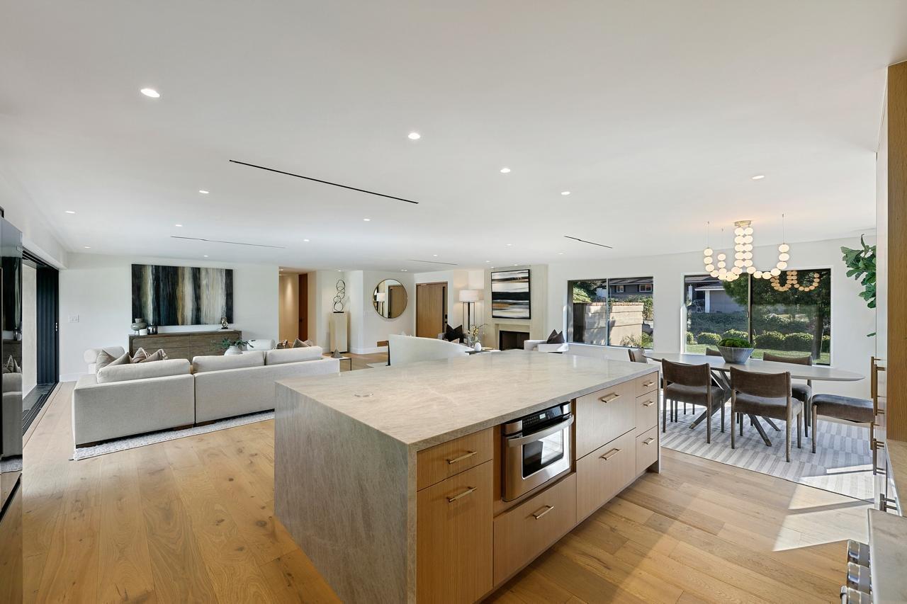 Kitchen island and dining room of a finished home